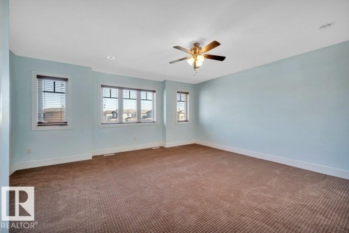 Unfurnished room with carpet and baseboards - 6221 167A Avenue, Edmonton, AB - Indoor Photo Showing Other Room