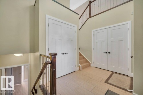 Entrance foyer featuring a towering ceiling, stairway, and light wood-style flooring - 6221 167A Avenue, Edmonton, AB - Indoor Photo Showing Other Room