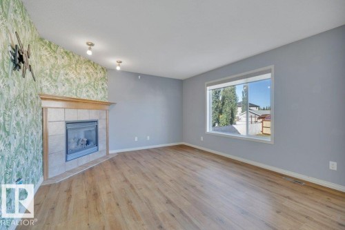 128 Southfork Drive, Leduc, AB - Indoor Photo Showing Other Room With Fireplace