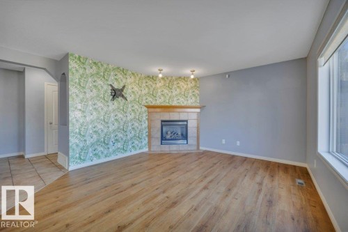 128 Southfork Drive, Leduc, AB - Indoor Photo Showing Living Room With Fireplace