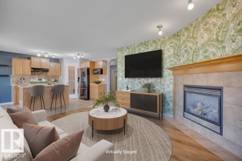128 Southfork Drive, Leduc, AB - Indoor Photo Showing Living Room With Fireplace