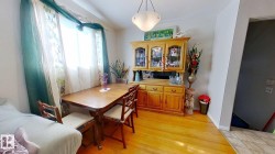 Dining area with light wood-type flooring and baseboards - 