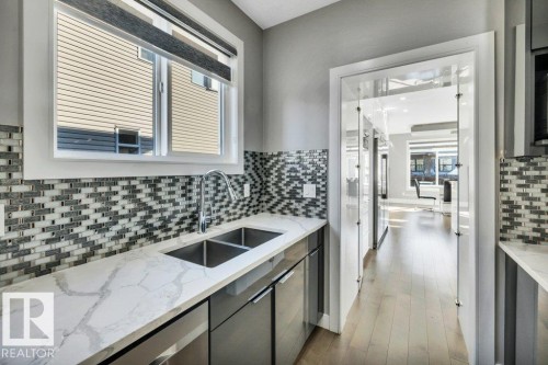 4405 Triomphe Gate, Beaumont, AB - Indoor Photo Showing Kitchen With Double Sink With Upgraded Kitchen