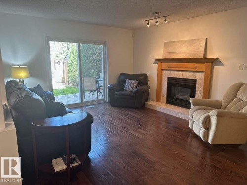 10020 97 Avenue, Edmonton, AB - Indoor Photo Showing Living Room With Fireplace
