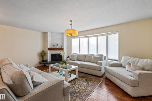 12803 47 Street, Edmonton, AB - Indoor Photo Showing Living Room With Fireplace