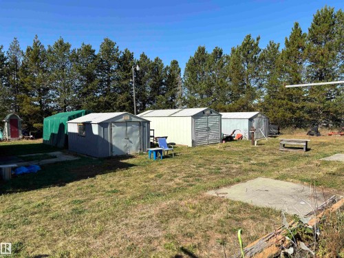 View of grassy yard with a shed - 140 Russel Drive, Rural St. Paul County, AB - Outdoor