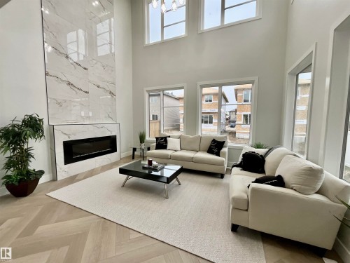 25 Baker Street, Ardrossan, AB - Indoor Photo Showing Living Room With Fireplace