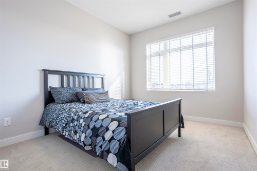 307 5151 Windermere Boulevard Nw, Edmonton, AB - Indoor Photo Showing Bedroom
