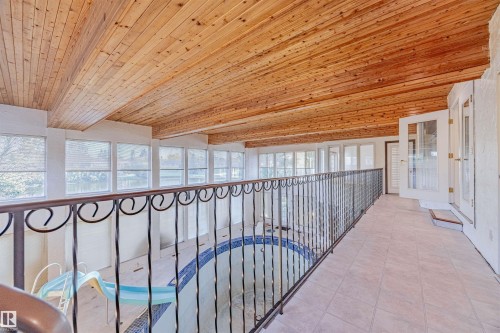 Hall with wooden ceiling and light tile patterned flooring - 1602 106 Street, Edmonton, AB - Indoor Photo Showing Other Room