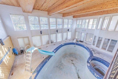 View of pool with a hot tub, a sunroom, and a water slide - 1602 106 Street, Edmonton, AB - Indoor Photo Showing Other Room