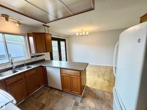 12231 44 Street Nw, Edmonton, AB - Indoor Photo Showing Kitchen With Double Sink