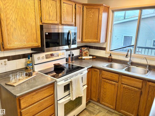 12231 44 Street Nw, Edmonton, AB - Indoor Photo Showing Kitchen With Double Sink