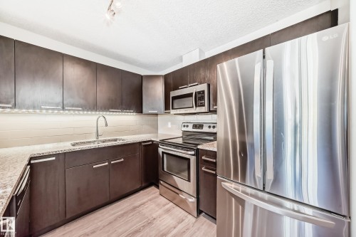 220 14808 125 Street, Edmonton, AB - Indoor Photo Showing Kitchen With Stainless Steel Kitchen With Upgraded Kitchen