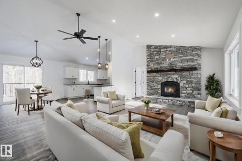 311 55504 Rr 13, Rural Lac Ste. Anne County, AB - Indoor Photo Showing Living Room With Fireplace