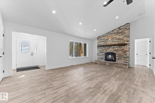 311 55504 Rr 13, Rural Lac Ste. Anne County, AB - Indoor Photo Showing Living Room With Fireplace