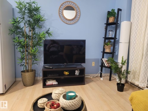 Living area with wood finished floors - 1704 10024 Jasper Avenue, Edmonton, AB - Indoor Photo Showing Other Room