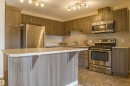 211 1820 Rutherford Road Sw, Edmonton, AB  - Indoor Photo Showing Kitchen With Stainless Steel Kitchen 