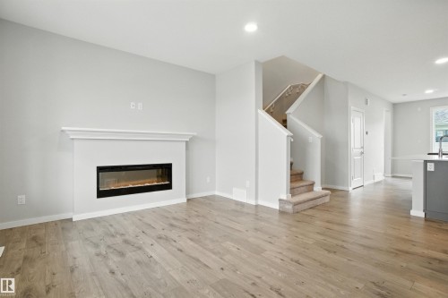 20727 25 Ave Nw, Edmonton, AB - Indoor Photo Showing Living Room With Fireplace