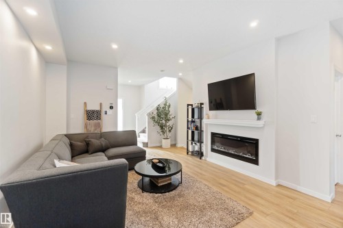 310 Balsam Link, Leduc, AB - Indoor Photo Showing Living Room With Fireplace