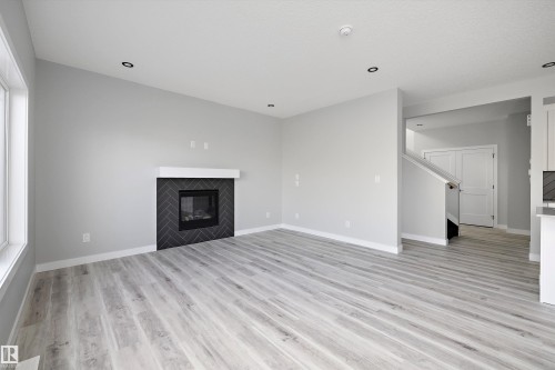 36 Maple Crescent, Gibbons, AB - Indoor Photo Showing Living Room With Fireplace