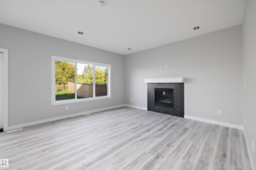 36 Maple Crescent, Gibbons, AB - Indoor Photo Showing Living Room With Fireplace