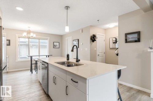 110 1530 Tamarack Boulevard, Edmonton, AB - Indoor Photo Showing Kitchen With Double Sink