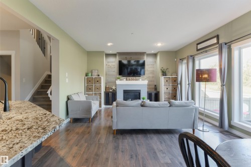 119 Brickyard Place, Stony Plain, AB - Indoor Photo Showing Living Room With Fireplace
