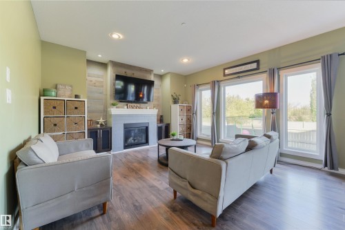 119 Brickyard Place, Stony Plain, AB - Indoor Photo Showing Living Room With Fireplace
