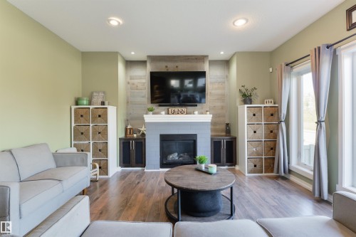 119 Brickyard Place, Stony Plain, AB - Indoor Photo Showing Living Room With Fireplace