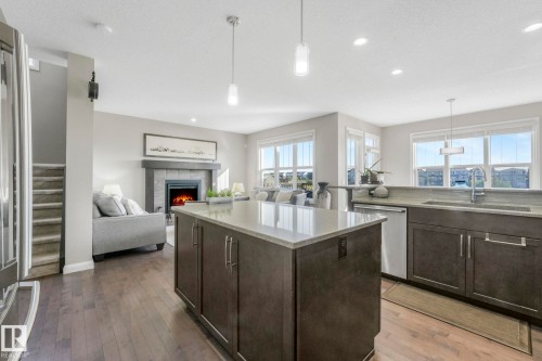 1298 Secord Landing Landing, Edmonton, AB - Indoor Photo Showing Kitchen With Fireplace With Upgraded Kitchen