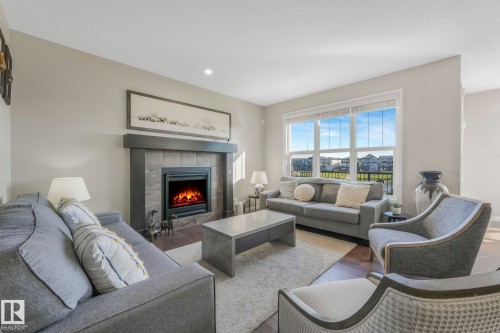 1298 Secord Landing Landing, Edmonton, AB - Indoor Photo Showing Living Room With Fireplace