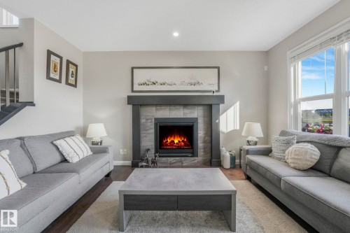 1298 Secord Landing Landing, Edmonton, AB - Indoor Photo Showing Living Room With Fireplace