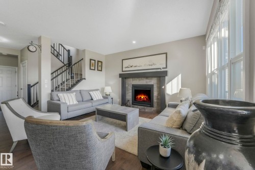 1298 Secord Landing Landing, Edmonton, AB - Indoor Photo Showing Living Room With Fireplace
