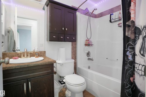 Full bathroom with shower / bath combo with shower curtain and vanity - 20705 56A Avenue, Edmonton, AB - Indoor Photo Showing Bathroom