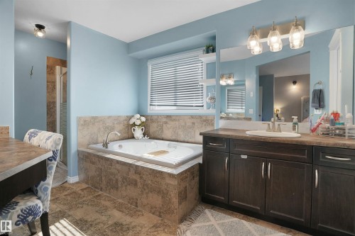 Full bath with vanity, a garden tub, and a stall shower - 20705 56A Avenue, Edmonton, AB - Indoor Photo Showing Bathroom