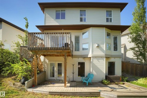 Rear view of house with a wooden deck, french doors, and a balcony - 20705 56A Avenue, Edmonton, AB - Outdoor With Deck Patio Veranda With Exterior