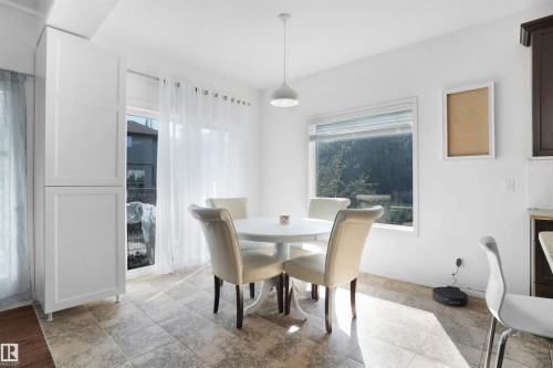 Dining area featuring baseboards - 20705 56A Avenue, Edmonton, AB - Indoor Photo Showing Dining Room