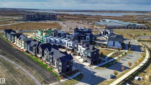 Aerial view of residential area featuring a large body of water - 68 5 Rondeau Drive, St. Albert, AB - Outdoor With View