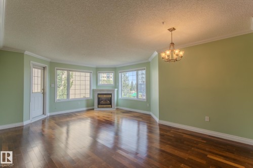 305 13450 114 Avenue, Edmonton, AB - Indoor Photo Showing Living Room With Fireplace