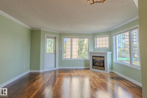 305 13450 114 Avenue, Edmonton, AB - Indoor Photo Showing Living Room With Fireplace