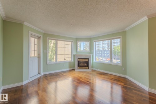 305 13450 114 Avenue, Edmonton, AB - Indoor Photo Showing Living Room With Fireplace