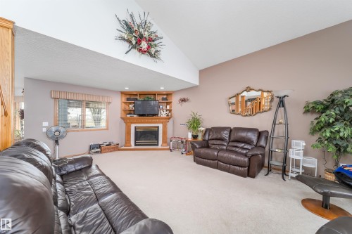 11415 9 Avenue, Edmonton, AB - Indoor Photo Showing Living Room With Fireplace