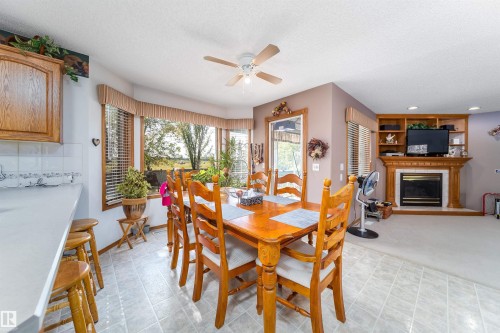 11415 9 Avenue, Edmonton, AB - Indoor Photo Showing Dining Room With Fireplace