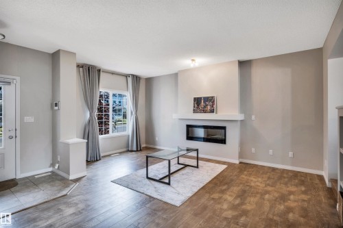 1271 Chappelle Boulevard, Edmonton, AB - Indoor Photo Showing Living Room With Fireplace