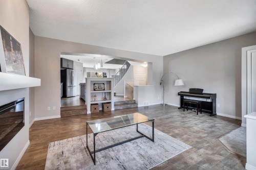 1271 Chappelle Boulevard, Edmonton, AB - Indoor Photo Showing Living Room With Fireplace