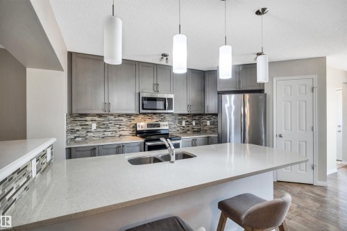 1271 Chappelle Boulevard, Edmonton, AB - Indoor Photo Showing Kitchen With Stainless Steel Kitchen With Double Sink With Upgraded Kitchen