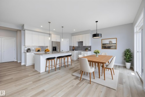 Dining area with light wood-type flooring and recessed lighting - 10214 92A Avenue, Morinville, AB - Indoor