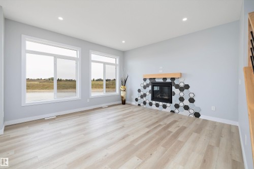 10214 92A Avenue, Morinville, AB - Indoor Photo Showing Living Room With Fireplace