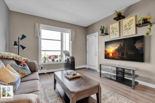 306 2588 Anderson Way, Edmonton, AB - Indoor Photo Showing Living Room