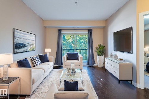 212 8730 82 Avenue, Edmonton, AB - Indoor Photo Showing Living Room